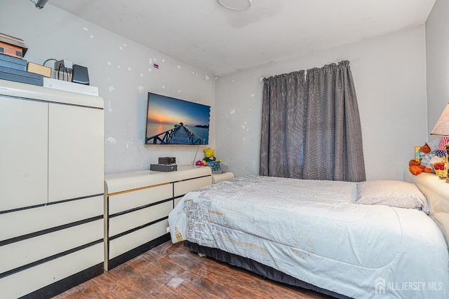 bedroom featuring dark wood-type flooring