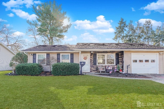 ranch-style home with a front lawn and a garage