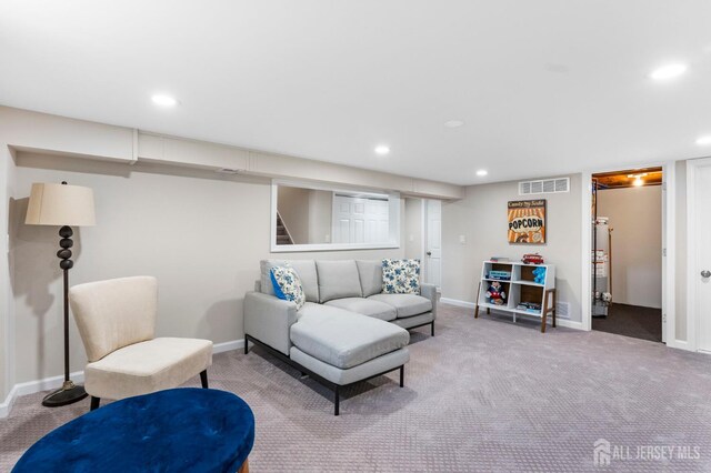 226 Schussler St, Sayreville, NJ 08879 - carpeted living area featuring recessed lighting and water heater