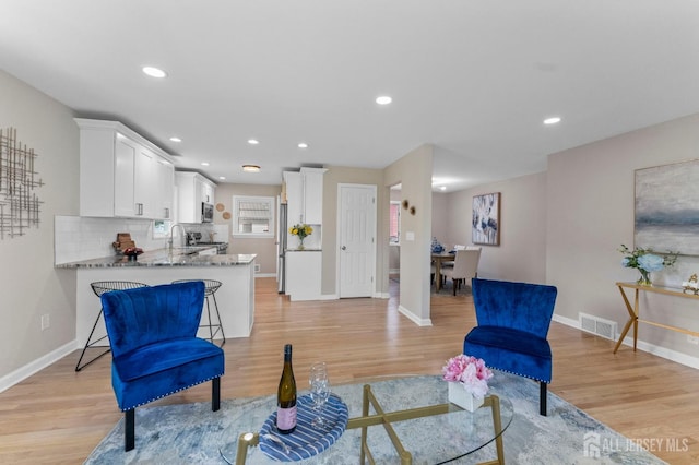 226 Schussler St, Sayreville, NJ 08879 - living room featuring light wood-type flooring and recessed lighting