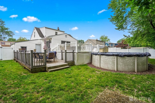 rear view of house with a deck