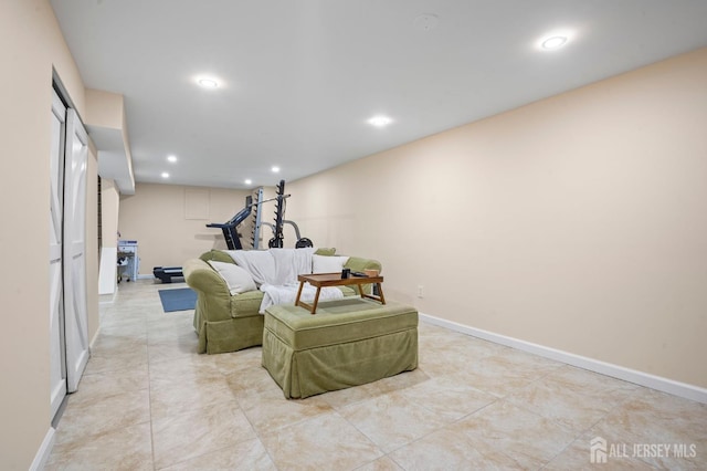 living area with recessed lighting and baseboards