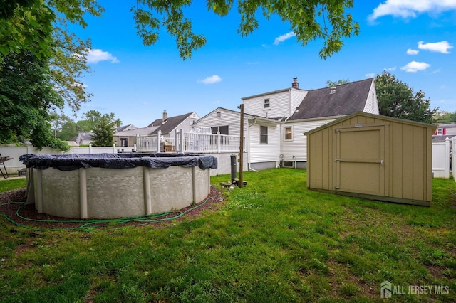 view of green lawn featuring a storage unit and an outdoor structure