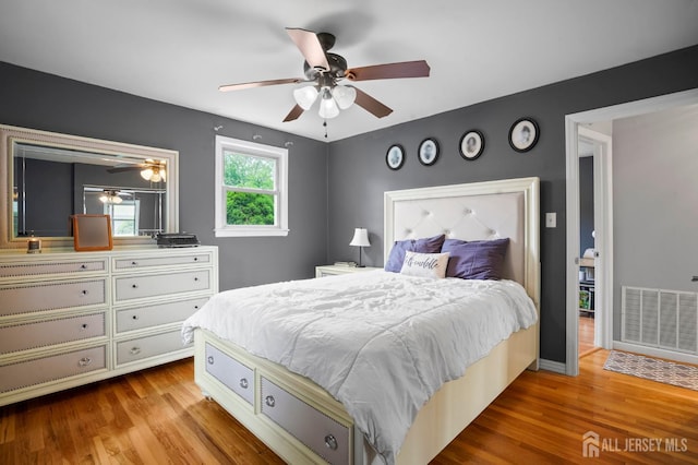 bedroom with wood finished floors and ceiling fan