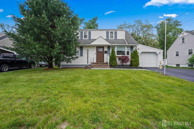 view of front of property with a garage, driveway, and a front yard