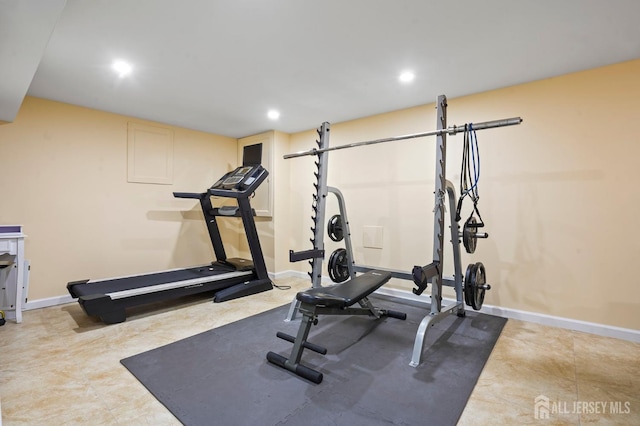 workout area featuring baseboards and recessed lighting