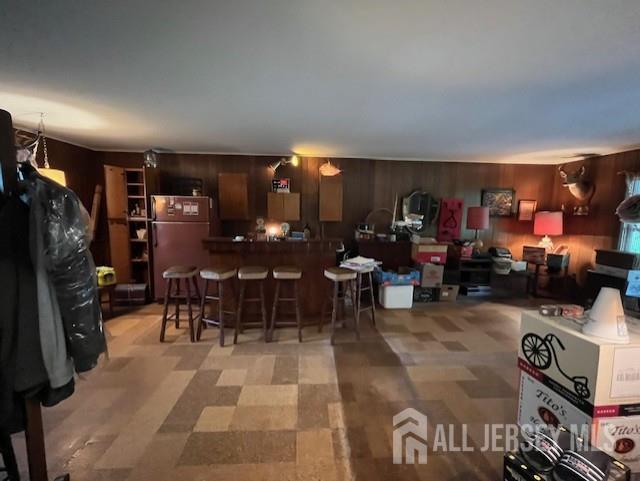 1436 Thomas Ave, North Brunswick, NJ 08902 - dining area with wooden walls and light flooring