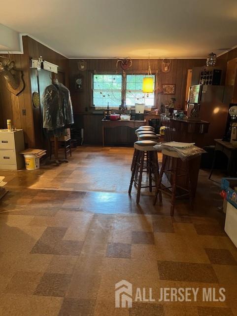 1436 Thomas Ave, North Brunswick, NJ 08902 - dining space featuring tile patterned floors and wooden walls