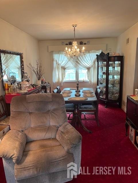 1436 Thomas Ave, North Brunswick, NJ 08902 - dining room with a chandelier and carpet floors
