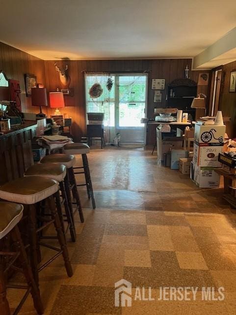 1436 Thomas Ave, North Brunswick, NJ 08902 - kitchen with tile patterned floors and wood walls