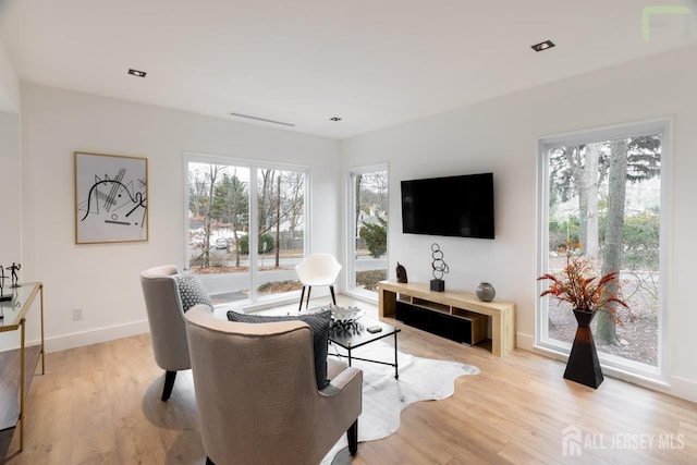 living room with light wood-style floors and baseboards