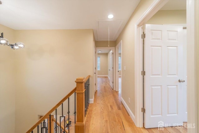 17 Fourth St, Hillsborough, NJ 08821 - corridor featuring attic access, an upstairs landing, light wood-style floors, and baseboards