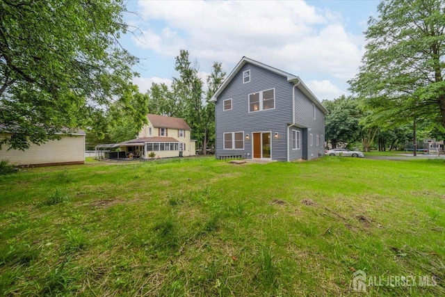 17 Fourth St, Hillsborough, NJ 08821 - rear view of house with a yard