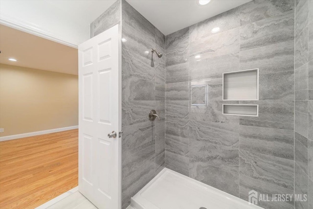 17 Fourth St, Hillsborough, NJ 08821 - bathroom with a tile shower, recessed lighting, wood finished floors, and baseboards