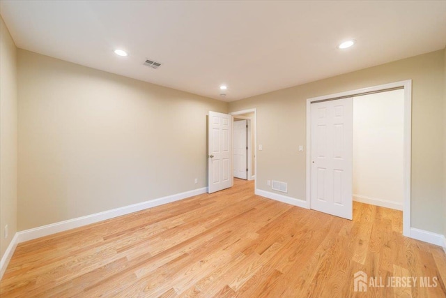 17 Fourth St, Hillsborough, NJ 08821 - unfurnished bedroom with light wood-type flooring, baseboards, recessed lighting, and a closet