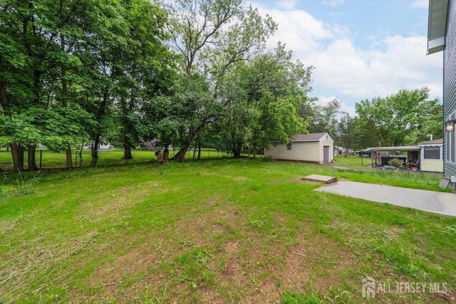 17 Fourth St, Hillsborough, NJ 08821 - view of green lawn with an outbuilding
