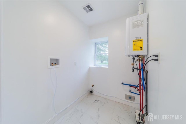 17 Fourth St, Hillsborough, NJ 08821 - laundry area with washer hookup, light marble finish flooring, tankless water heater, and baseboards