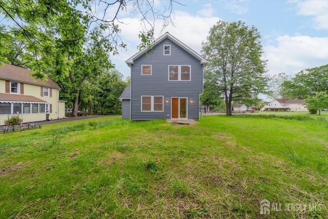 17 Fourth St, Hillsborough, NJ 08821 - rear view of house featuring a yard