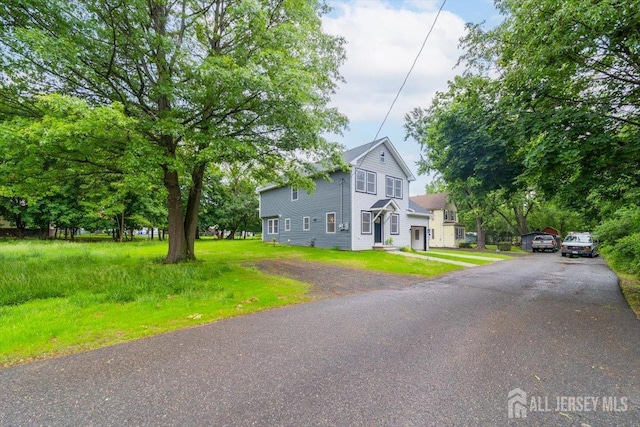 17 Fourth St, Hillsborough, NJ 08821 - view of front of property featuring driveway and a front yard