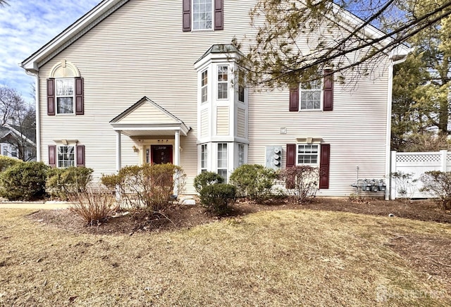 view of front of home with fence