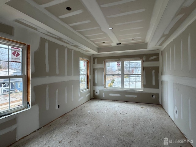 unfurnished room featuring plenty of natural light