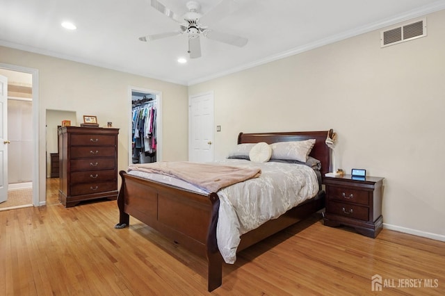 4 Franklin Ct, East Brunswick, NJ 08816 - bedroom featuring light wood-type flooring, ornamental molding, recessed lighting, a spacious closet, and a ceiling fan