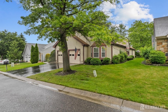 31 Ingram Dr, Monroe, NJ 08831 - obstructed view of property with driveway, an attached garage, and a front yard