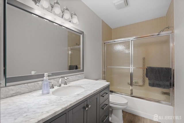 31 Ingram Dr, Monroe, NJ 08831 - bathroom with vanity, enclosed tub / shower combo, and wood finished floors