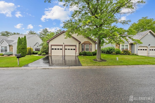 31 Ingram Dr, Monroe, NJ 08831 - view of front facade with a front lawn, an attached garage, and asphalt driveway