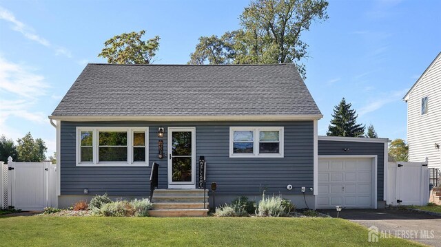 view of front facade with a garage and a front yard