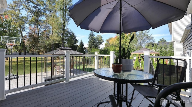 wooden deck featuring a gazebo