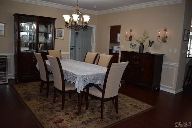 dining space with an inviting chandelier, beverage cooler, dark hardwood / wood-style flooring, and ornamental molding