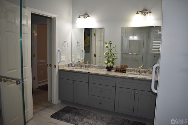 bathroom featuring double vanity, walk in shower, and tile patterned floors