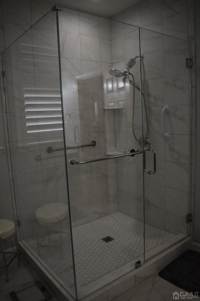 bathroom featuring toilet, tile patterned flooring, and an enclosed shower