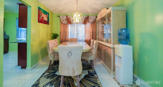 340 Park Ave, Old Bridge, NJ 08857 - dining space featuring a chandelier, light tile patterned floors, and baseboards