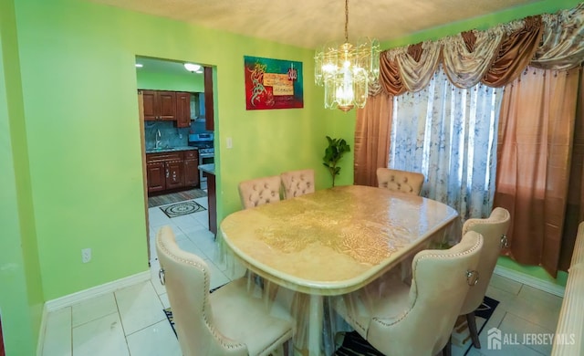 340 Park Ave, Old Bridge, NJ 08857 - dining room featuring a chandelier, light tile patterned flooring, and baseboards