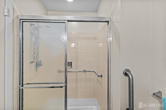 bathroom featuring a stall shower