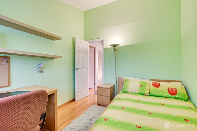 bedroom with light hardwood / wood-style floors