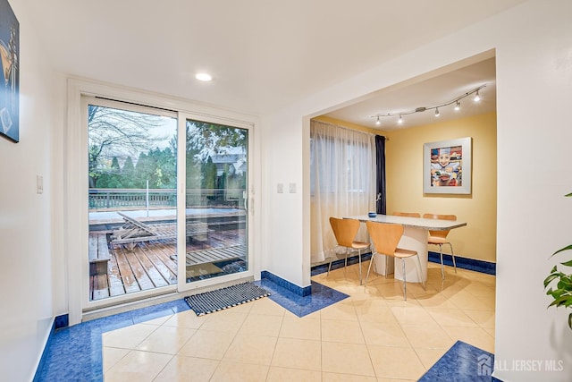 entryway with light tile patterned floors