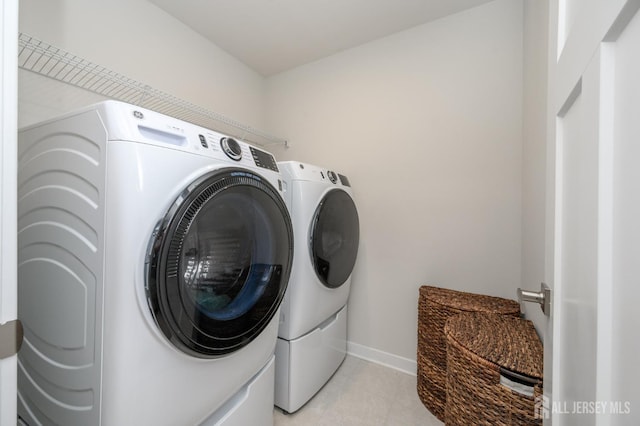 45 Athens Way, Aberdeen, NJ 07721 - laundry area featuring washer and clothes dryer and light tile patterned floors