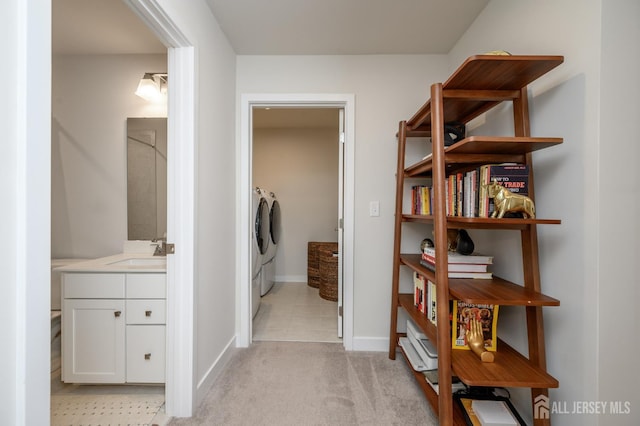 45 Athens Way, Aberdeen, NJ 07721 - hallway featuring washer and clothes dryer and light carpet