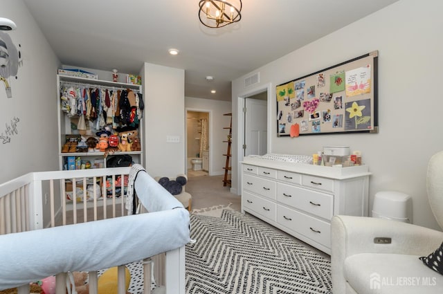 45 Athens Way, Aberdeen, NJ 07721 - bedroom with light colored carpet, recessed lighting, and a crib