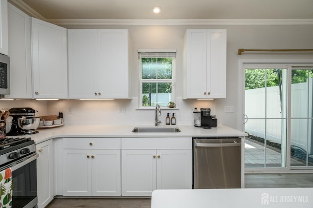 45 Athens Way, Aberdeen, NJ 07721 - kitchen with appliances with stainless steel finishes, white cabinetry, crown molding, and recessed lighting