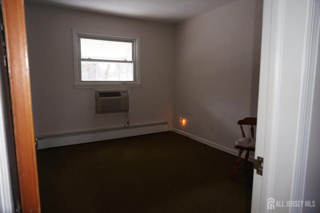 empty room featuring baseboards, baseboard heating, and a wall mounted air conditioner