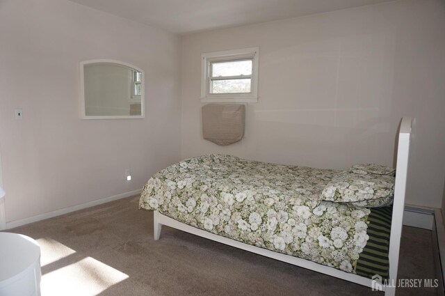 bedroom with carpet flooring and baseboards