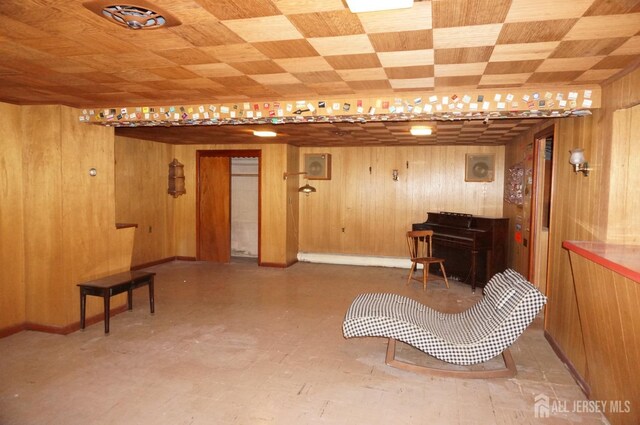 living area featuring wooden walls