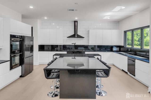 36 School Rd E, Marlboro, NJ 07746 - kitchen featuring wall chimney range hood, black appliances, modern cabinets, dark countertops, and recessed lighting