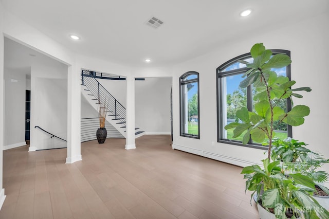 36 School Rd E, Marlboro, NJ 07746 - empty room featuring stairs, recessed lighting, wood finished floors, and baseboard heating