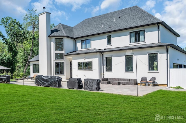 36 School Rd E, Marlboro, NJ 07746 - rear view of house featuring a patio, a chimney, stucco siding, and a lawn