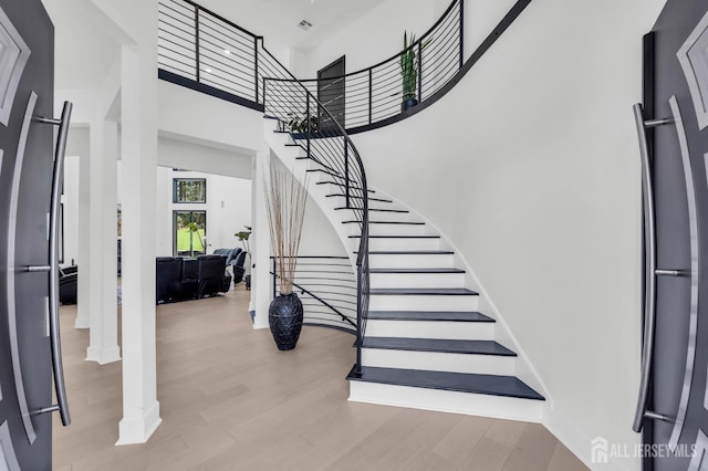 36 School Rd E, Marlboro, NJ 07746 - foyer featuring stairway, wood finished floors, and a towering ceiling